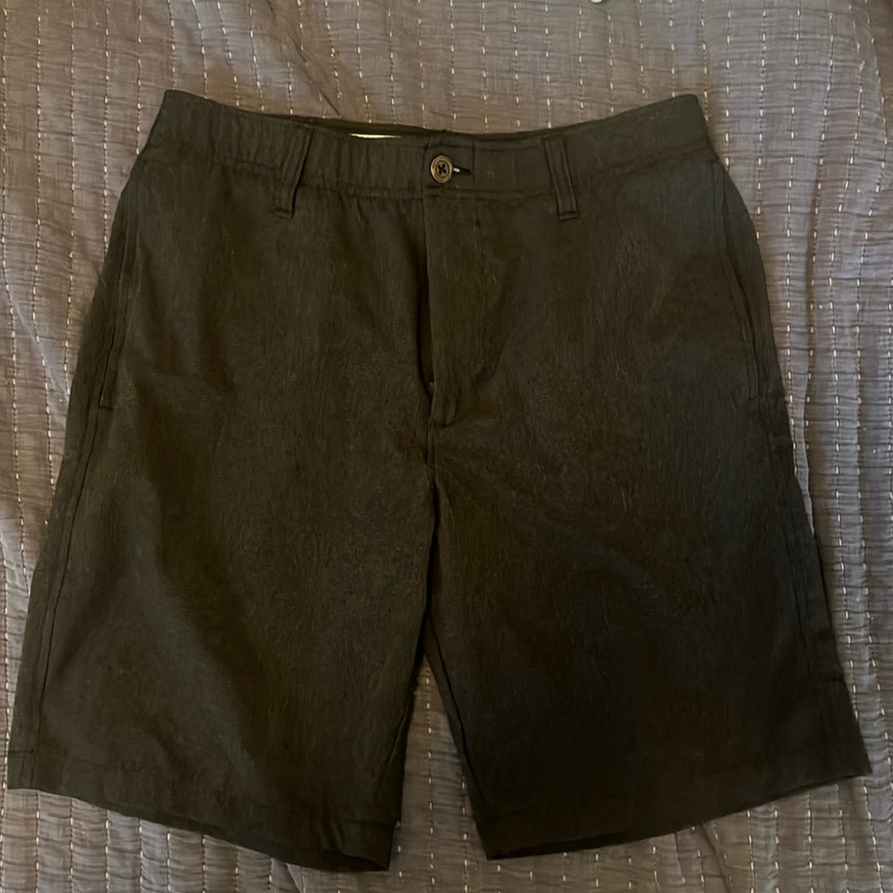 UA black golf shorts